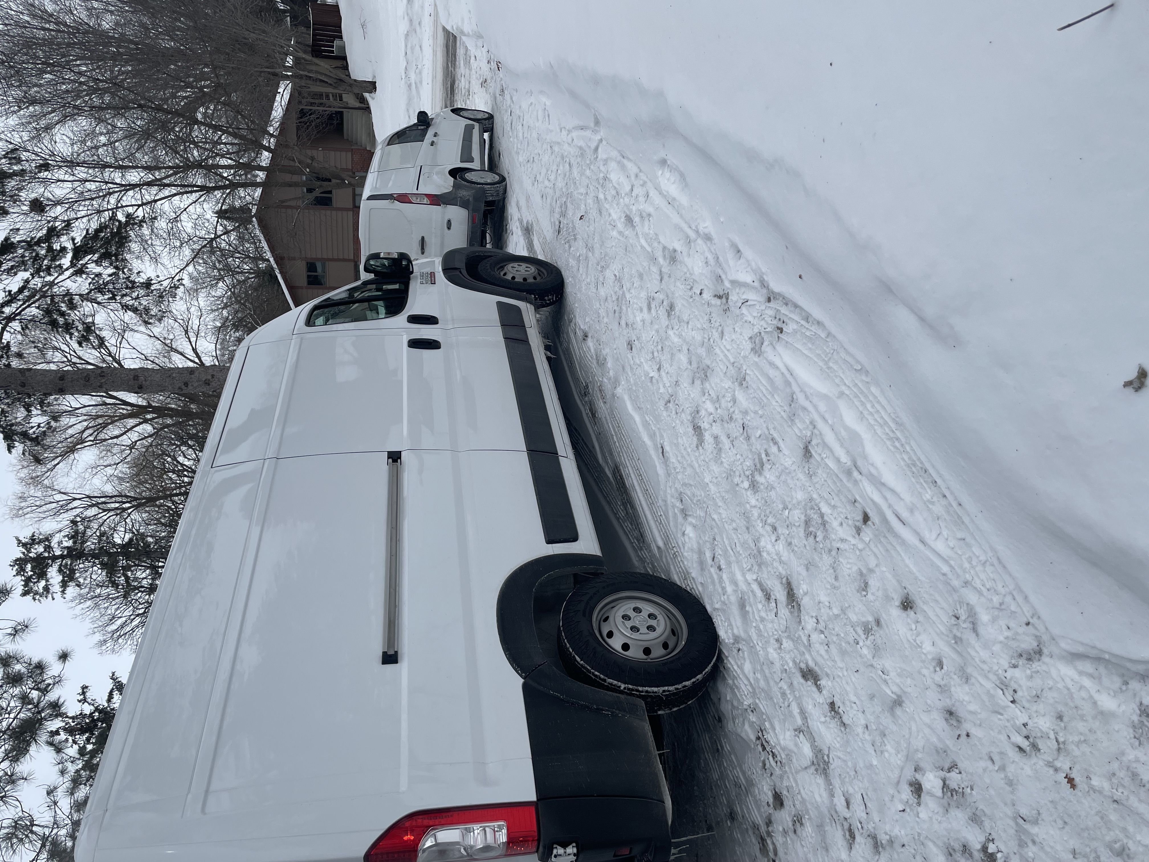 American Restores Group emergency response vehicles parked in snowy winter conditions, demonstrating 24/7 availability and rapid response capability for water damage emergencies in Minneapolis and Saint Paul area