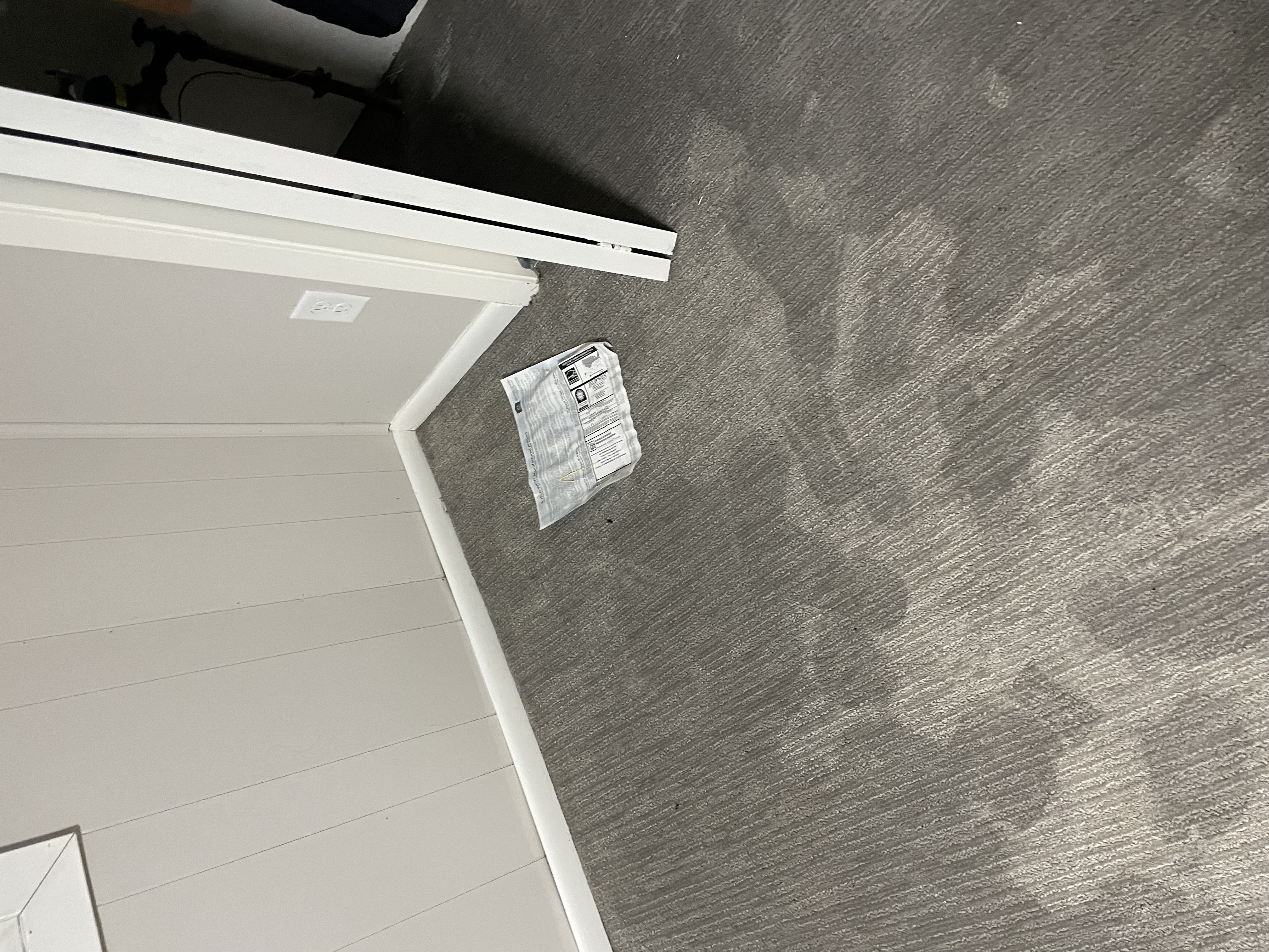 Water damage to commercial carpet with visible stains and discoloration requiring professional restoration services Minneapolis Minnesota